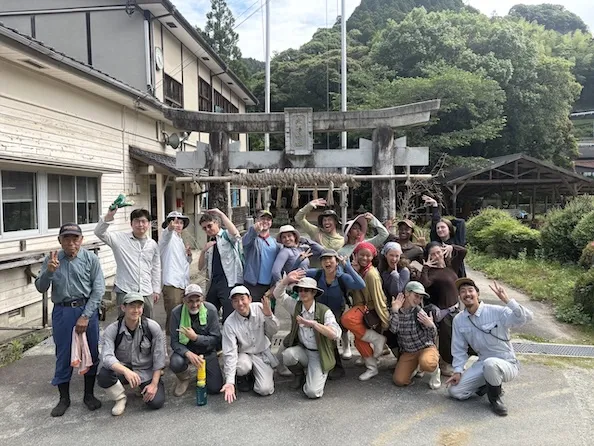 Columbia Summer in Itoshima participants in front of a torii gate at Sansonjuku, June 2026. 